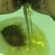 A very cute girl shits into a toilet from under ass. A short hang, then pissing over the product in the bowl. Filmed from a between the legs perspective. Vertical format video. Under a minute.